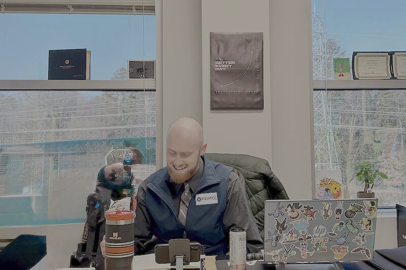 A Palmora team member working at their desk in the Charlotte office