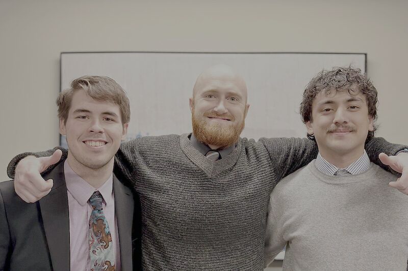 Three Palmora team members together in the office