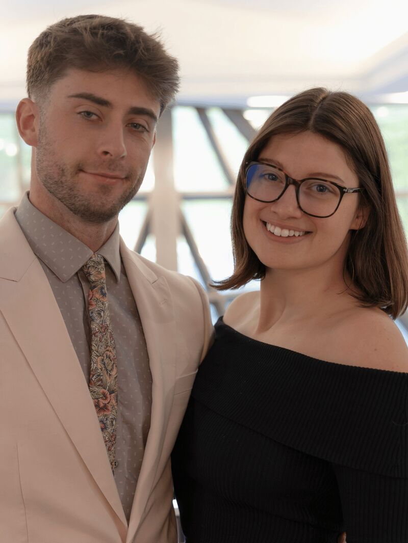 Two Palmora team members smiling together at a company event